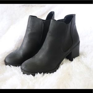 Black Chelsea boots.